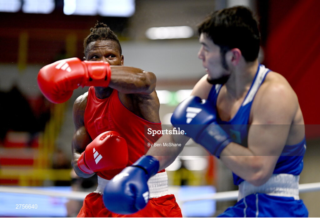 8 March 2024; Prewa Padabadi of Togo, left, in action against Nurbek Oralbay of Kazakhstan during their Men's 80kg Round of 32 bout during day six at the Paris 2024 Olympic Boxing Qualification Tournament at E-Work Arena in Busto Arsizio, Italy. Photo by Ben McShane/Sportsfile