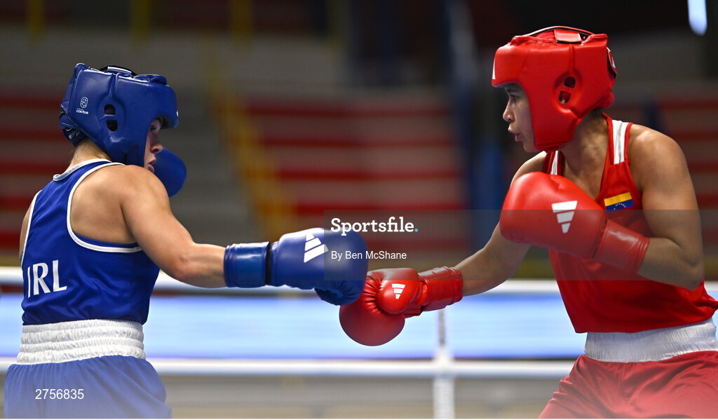 8 March 2024; Daina Moorehouse of Ireland, left, in action against Tayonis Cedeno of Venezuela during their Women's 50kg Round of 32 bout against during day six at the Paris 2024 Olympic Boxing Qualification Tournament at E-Work Arena in Busto Arsizio, Italy. Photo by Ben McShane/Sportsfile