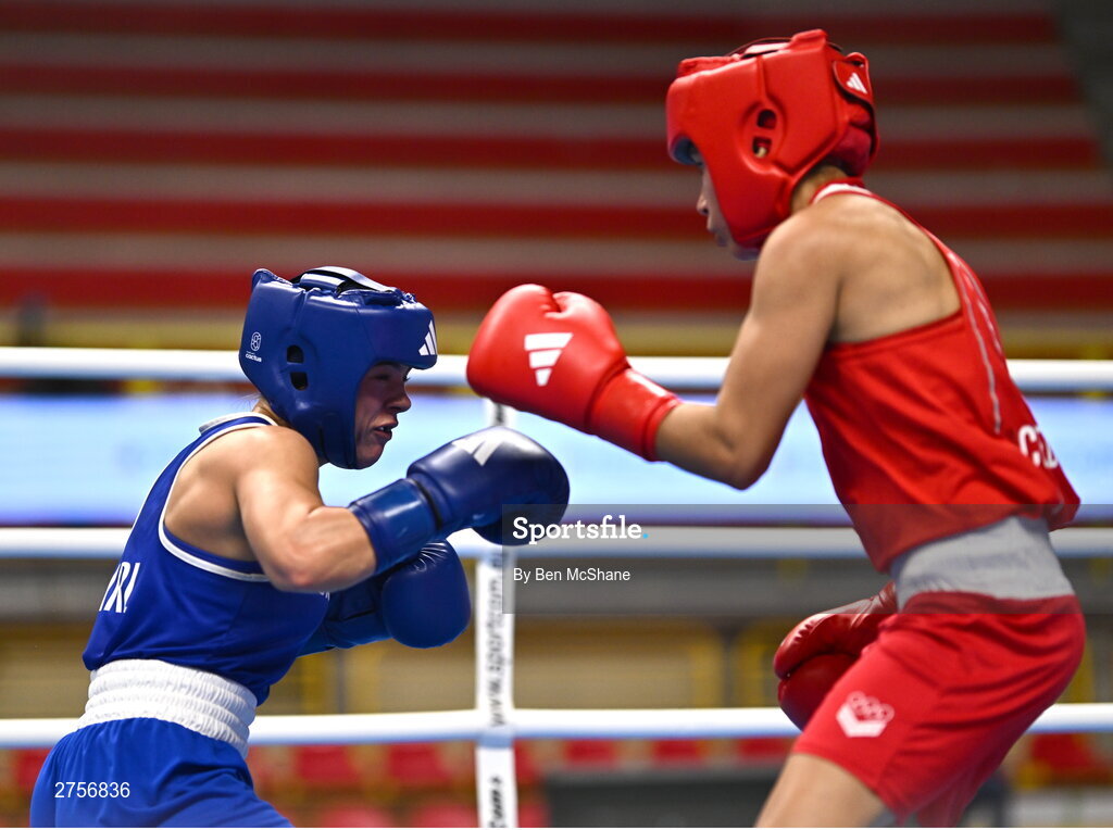 8 March 2024; Daina Moorehouse of Ireland, left, in action against Tayonis Cedeno of Venezuela during their Women's 50kg Round of 32 bout against during day six at the Paris 2024 Olympic Boxing Qualification Tournament at E-Work Arena in Busto Arsizio, Italy. Photo by Ben McShane/Sportsfile
