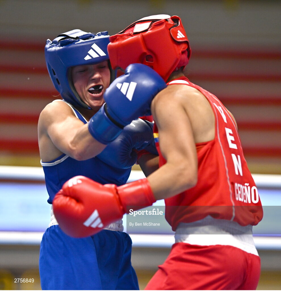 8 March 2024; Daina Moorehouse of Ireland, left, in action against Tayonis Cedeno of Venezuela during their Women's 50kg Round of 32 bout against during day six at the Paris 2024 Olympic Boxing Qualification Tournament at E-Work Arena in Busto Arsizio, Italy. Photo by Ben McShane/Sportsfile