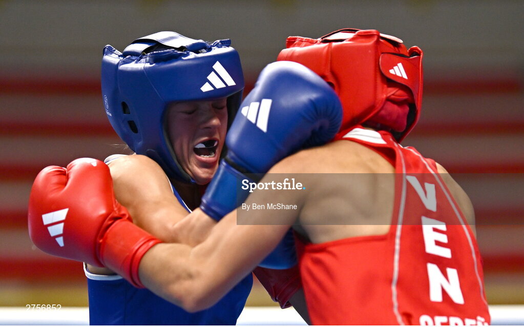 8 March 2024; Daina Moorehouse of Ireland, left, in action against Tayonis Cedeno of Venezuela during their Women's 50kg Round of 32 bout against during day six at the Paris 2024 Olympic Boxing Qualification Tournament at E-Work Arena in Busto Arsizio, Italy. Photo by Ben McShane/Sportsfile