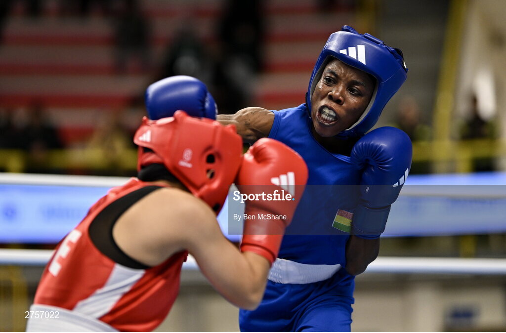 8 March 2024; Yi-Xuan Guo of Chinese Taipei, left, in action against Janet Acquah of Ghana during their Women's 50kg Round of 32 bout during day six at the Paris 2024 Olympic Boxing Qualification Tournament at E-Work Arena in Busto Arsizio, Italy. Photo by Ben McShane/Sportsfile