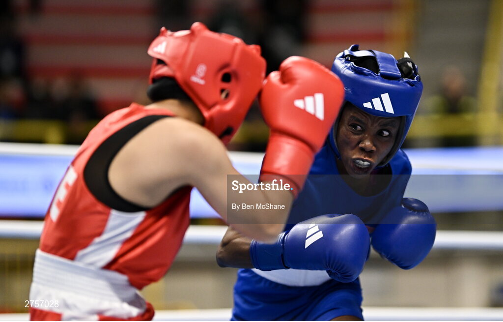 8 March 2024; Yi-Xuan Guo of Chinese Taipei, left, in action against Janet Acquah of Ghana during their Women's 50kg Round of 32 bout during day six at the Paris 2024 Olympic Boxing Qualification Tournament at E-Work Arena in Busto Arsizio, Italy. Photo by Ben McShane/Sportsfile