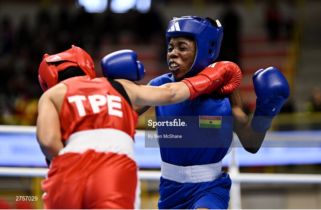 8 March 2024; Yi-Xuan Guo of Chinese Taipei, left, in action against Janet Acquah of Ghana during their Women's 50kg Round of 32 bout during day six at the Paris 2024 Olympic Boxing Qualification Tournament at E-Work Arena in Busto Arsizio, Italy. Photo by Ben McShane/Sportsfile