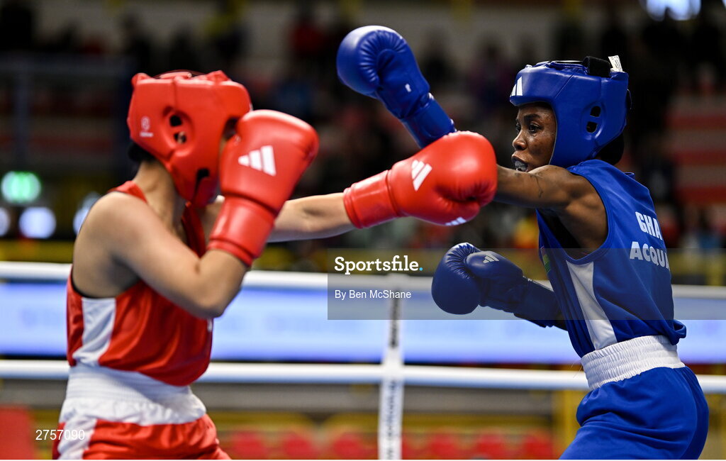 8 March 2024; Yi-Xuan Guo of Chinese Taipei, left, in action against Janet Acquah of Ghana during their Women's 50kg Round of 32 bout during day six at the Paris 2024 Olympic Boxing Qualification Tournament at E-Work Arena in Busto Arsizio, Italy. Photo by Ben McShane/Sportsfile