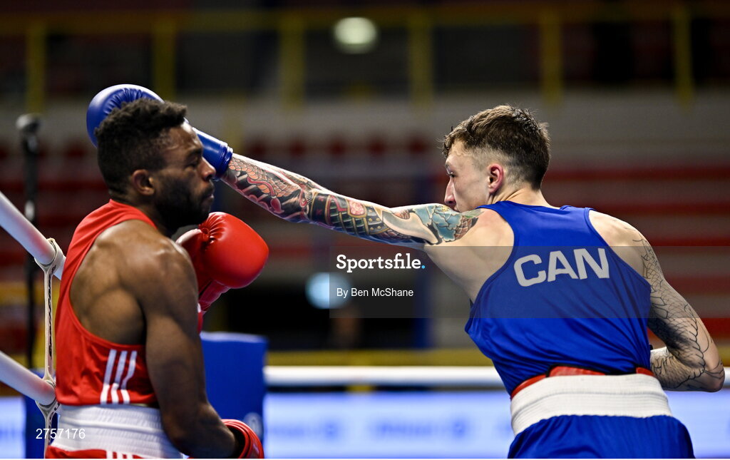 8 March 2024; Pedro Manuel Gomes of Angola, left, in action against Victor Tremblay of Canada during their Men's 57kg Round of 32 bout during day six at the Paris 2024 Olympic Boxing Qualification Tournament at E-Work Arena in Busto Arsizio, Italy. Photo by Ben McShane/Sportsfile