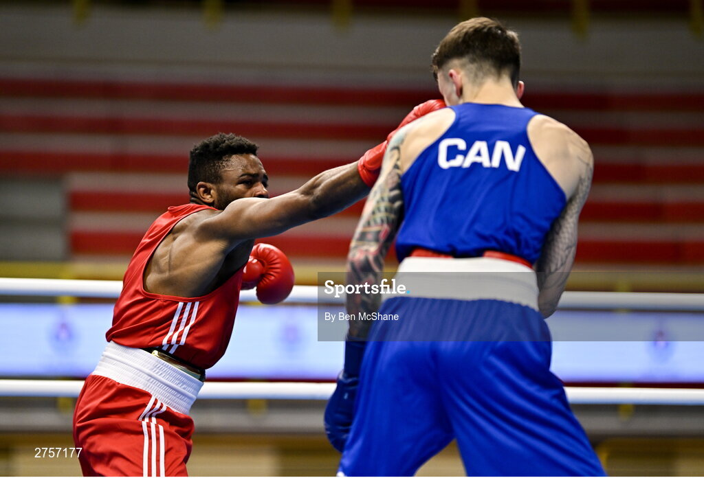 8 March 2024; Pedro Manuel Gomes of Angola, left, in action against Victor Tremblay of Canada during their Men's 57kg Round of 32 bout during day six at the Paris 2024 Olympic Boxing Qualification Tournament at E-Work Arena in Busto Arsizio, Italy. Photo by Ben McShane/Sportsfile