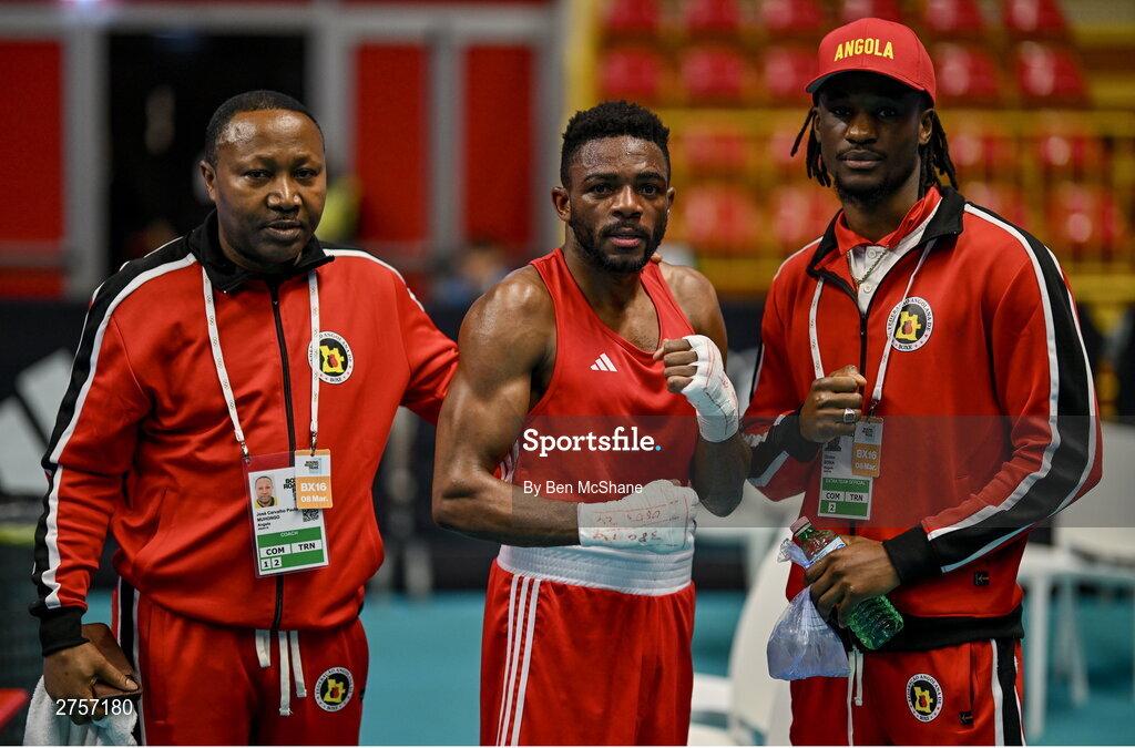 8 March 2024; Pedro Manuel Gomes of Angola poses with Angola coaches Dirsino Boika, right, and Paulo Carvalho José Muhongo after their victory in the Men's 57kg Round of 32 bout against Victor Tremblay of Canada during day six at the Paris 2024 Olympic Boxing Qualification Tournament at E-Work Arena in Busto Arsizio, Italy. Photo by Ben McShane/Sportsfile