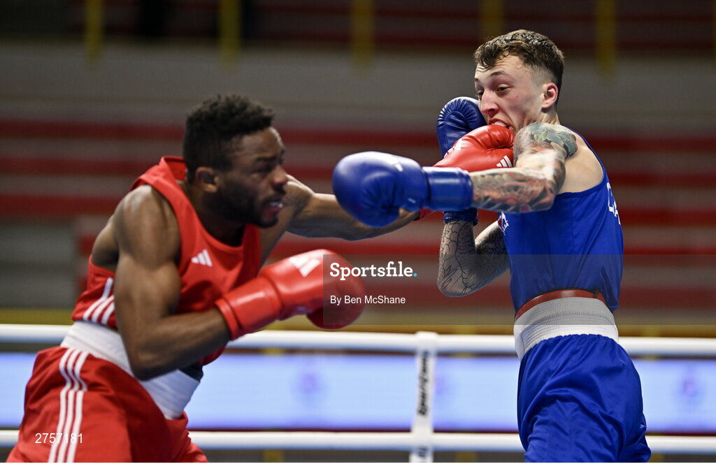 8 March 2024; Pedro Manuel Gomes of Angola, left, in action against Victor Tremblay of Canada during their Men's 57kg Round of 32 bout during day six at the Paris 2024 Olympic Boxing Qualification Tournament at E-Work Arena in Busto Arsizio, Italy. Photo by Ben McShane/Sportsfile