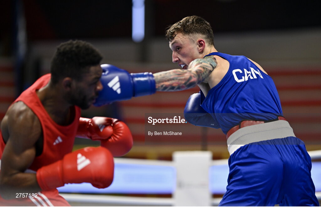 8 March 2024; Pedro Manuel Gomes of Angola, left, in action against Victor Tremblay of Canada during their Men's 57kg Round of 32 bout during day six at the Paris 2024 Olympic Boxing Qualification Tournament at E-Work Arena in Busto Arsizio, Italy. Photo by Ben McShane/Sportsfile