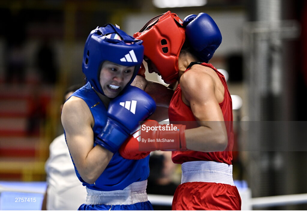 8 March 2024; Elise Glynn of Great Britain, right, in action against Zichun Xu of China during their Women's 57kg Round of 32 bout during day six at the Paris 2024 Olympic Boxing Qualification Tournament at E-Work Arena in Busto Arsizio, Italy. Photo by Ben McShane/Sportsfile