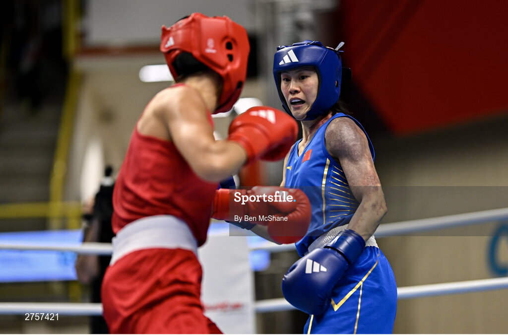 8 March 2024; Elise Glynn of Great Britain, left, in action against Zichun Xu of China during their Women's 57kg Round of 32 bout during day six at the Paris 2024 Olympic Boxing Qualification Tournament at E-Work Arena in Busto Arsizio, Italy. Photo by Ben McShane/Sportsfile