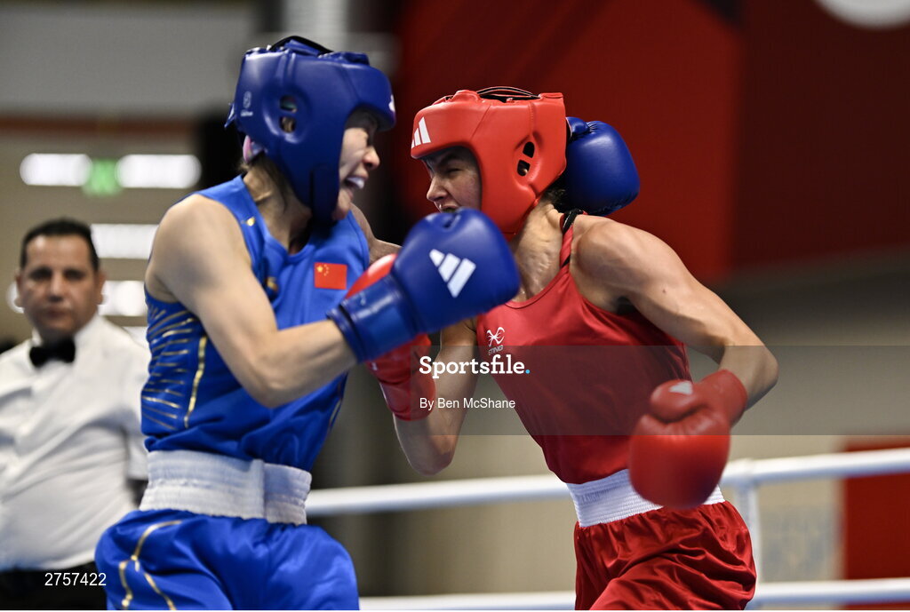8 March 2024; Elise Glynn of Great Britain, right, in action against Zichun Xu of China during their Women's 57kg Round of 32 bout during day six at the Paris 2024 Olympic Boxing Qualification Tournament at E-Work Arena in Busto Arsizio, Italy. Photo by Ben McShane/Sportsfile