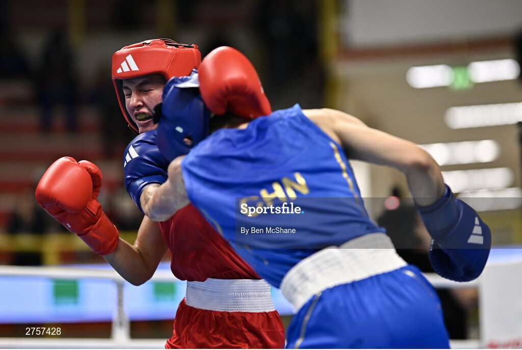 8 March 2024; Elise Glynn of Great Britain, left, in action against Zichun Xu of China during their Women's 57kg Round of 32 bout during day six at the Paris 2024 Olympic Boxing Qualification Tournament at E-Work Arena in Busto Arsizio, Italy. Photo by Ben McShane/Sportsfile