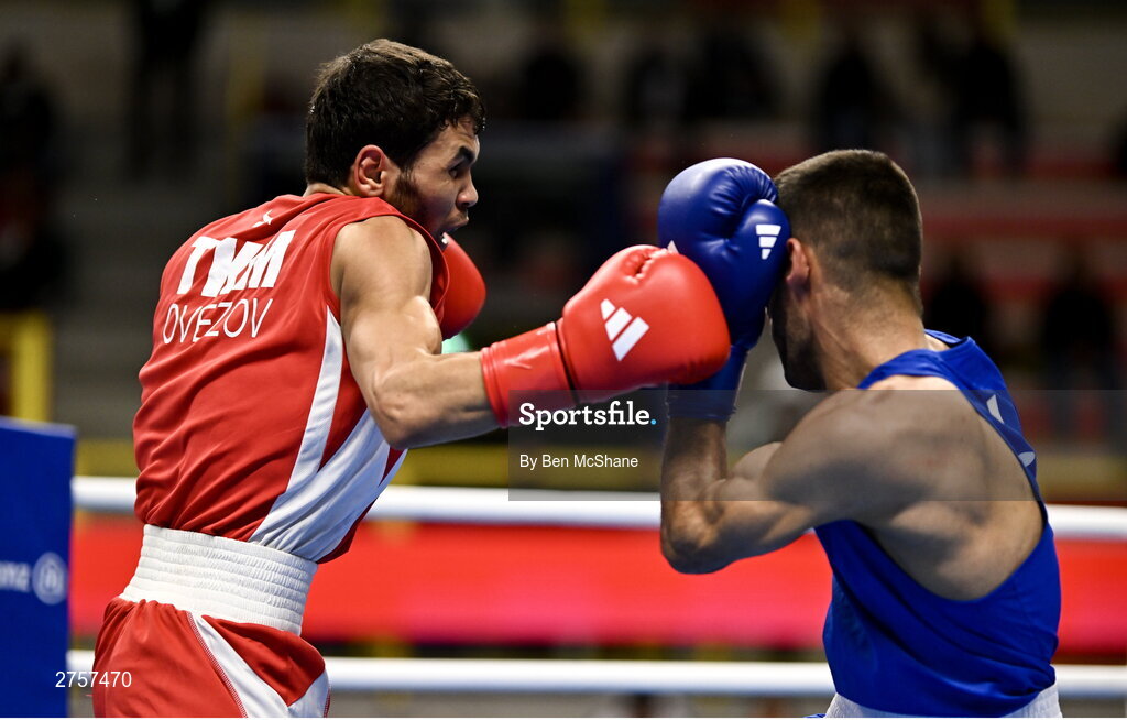 8 March 2024; Shakur Ovezov of Turkmenistan, left, in action against Daniyal Shahbakhsh of Iran during their Men's 57kg Round of 32 bout during day six at the Paris 2024 Olympic Boxing Qualification Tournament at E-Work Arena in Busto Arsizio, Italy. Photo by Ben McShane/Sportsfile