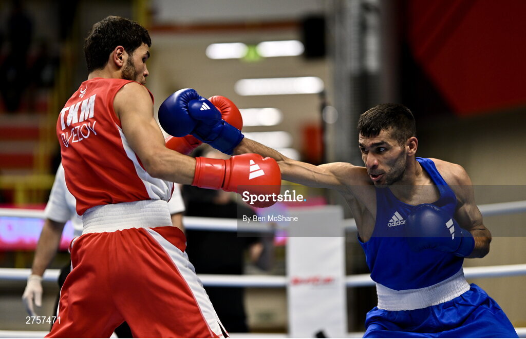 8 March 2024; Shakur Ovezov of Turkmenistan, left, in action against Daniyal Shahbakhsh of Iran during their Men's 57kg Round of 32 bout during day six at the Paris 2024 Olympic Boxing Qualification Tournament at E-Work Arena in Busto Arsizio, Italy. Photo by Ben McShane/Sportsfile