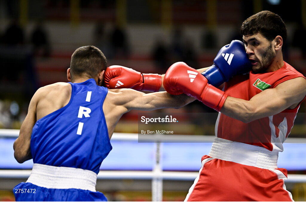 8 March 2024; Shakur Ovezov of Turkmenistan, right, in action against Daniyal Shahbakhsh of Iran during their Men's 57kg Round of 32 bout during day six at the Paris 2024 Olympic Boxing Qualification Tournament at E-Work Arena in Busto Arsizio, Italy. Photo by Ben McShane/Sportsfile