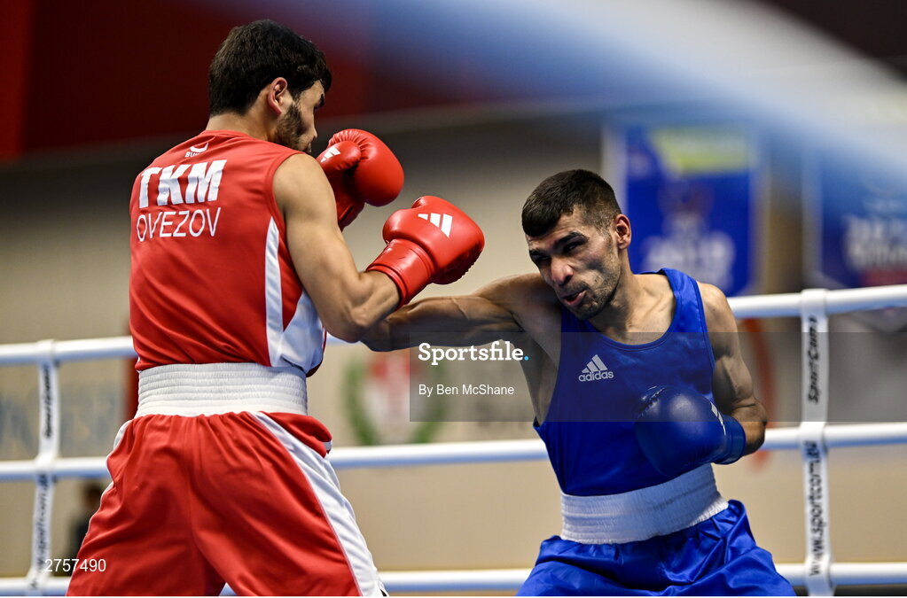8 March 2024; Shakur Ovezov of Turkmenistan, left, in action against Daniyal Shahbakhsh of Iran during their Men's 57kg Round of 32 bout during day six at the Paris 2024 Olympic Boxing Qualification Tournament at E-Work Arena in Busto Arsizio, Italy. Photo by Ben McShane/Sportsfile