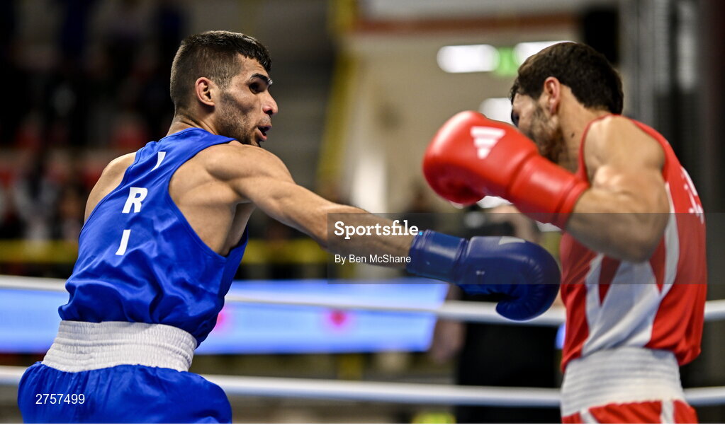 8 March 2024; Shakur Ovezov of Turkmenistan, right, in action against Daniyal Shahbakhsh of Iran during their Men's 57kg Round of 32 bout during day six at the Paris 2024 Olympic Boxing Qualification Tournament at E-Work Arena in Busto Arsizio, Italy. Photo by Ben McShane/Sportsfile