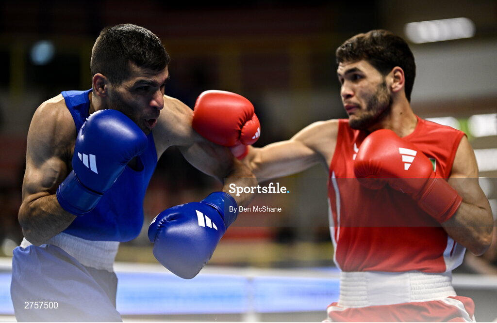 8 March 2024; Shakur Ovezov of Turkmenistan, right, in action against Daniyal Shahbakhsh of Iran during their Men's 57kg Round of 32 bout during day six at the Paris 2024 Olympic Boxing Qualification Tournament at E-Work Arena in Busto Arsizio, Italy. Photo by Ben McShane/Sportsfile