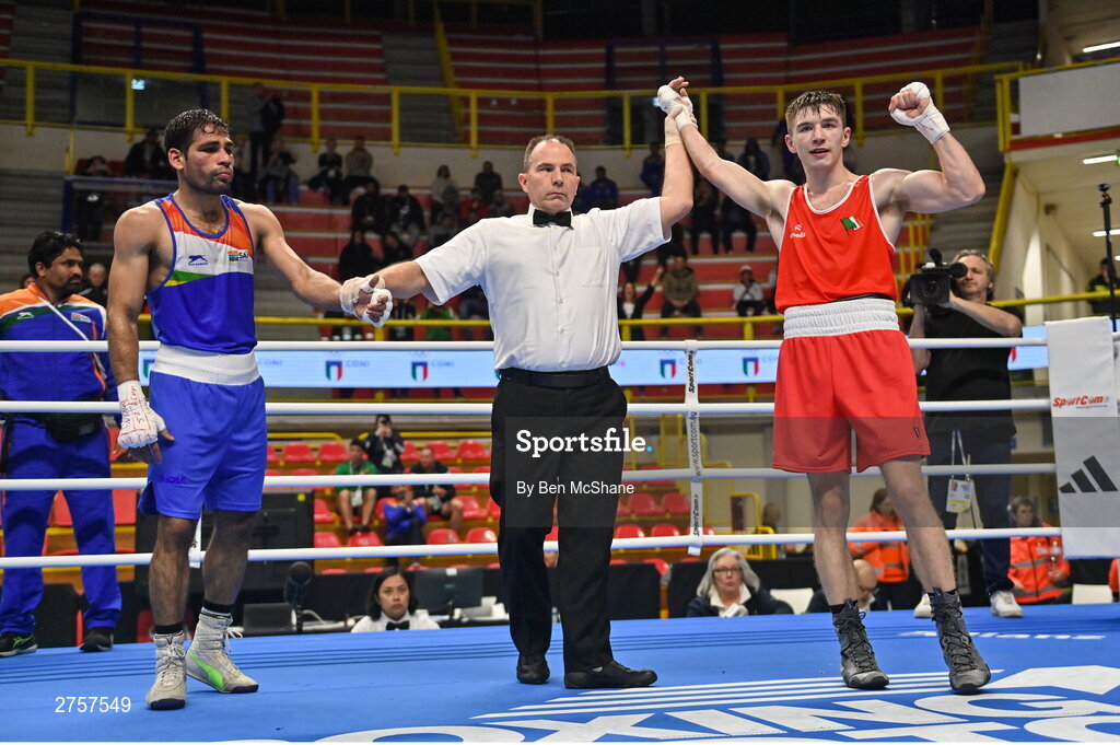 8 March 2024; Jude Gallagher of Ireland, right, is declared victorious over Uddin Mohammed Hussam of India during their Men's 57kg Round of 32 bout during day six at the Paris 2024 Olympic Boxing Qualification Tournament at E-Work Arena in Busto Arsizio, Italy. Photo by Ben McShane/Sportsfile