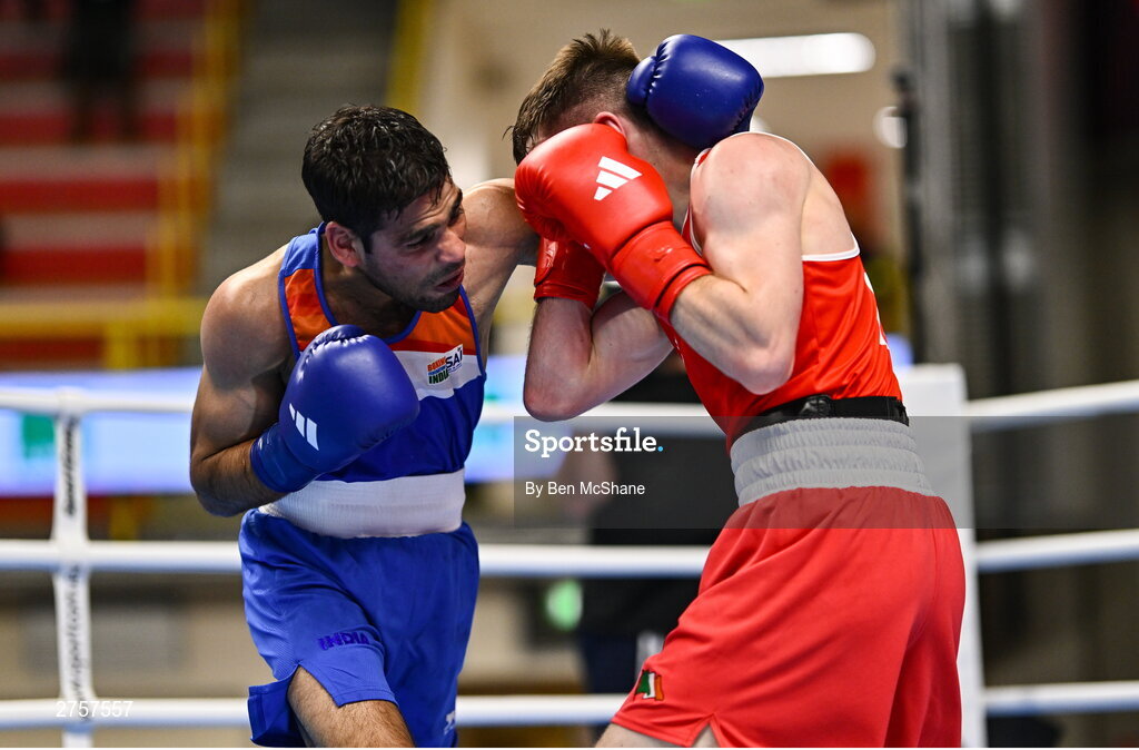 8 March 2024; Jude Gallagher of Ireland, right, in action against Uddin Mohammed Hussam of India during their Men's 57kg Round of 32 bout during day six at the Paris 2024 Olympic Boxing Qualification Tournament at E-Work Arena in Busto Arsizio, Italy. Photo by Ben McShane/Sportsfile
