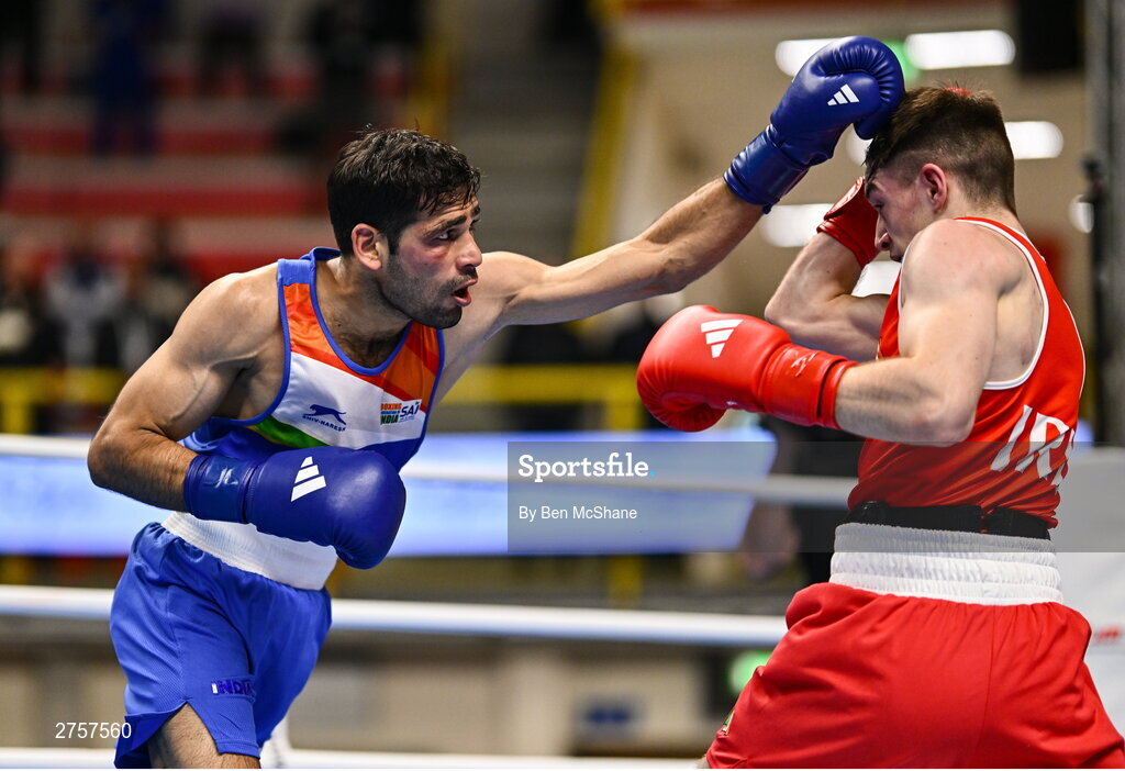 8 March 2024; Jude Gallagher of Ireland, right, in action against Uddin Mohammed Hussam of India during their Men's 57kg Round of 32 bout during day six at the Paris 2024 Olympic Boxing Qualification Tournament at E-Work Arena in Busto Arsizio, Italy. Photo by Ben McShane/Sportsfile