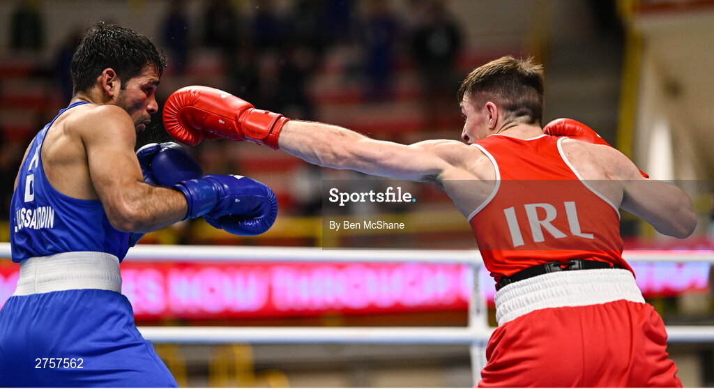 8 March 2024; Jude Gallagher of Ireland, right, in action against Uddin Mohammed Hussam of India during their Men's 57kg Round of 32 bout during day six at the Paris 2024 Olympic Boxing Qualification Tournament at E-Work Arena in Busto Arsizio, Italy. Photo by Ben McShane/Sportsfile