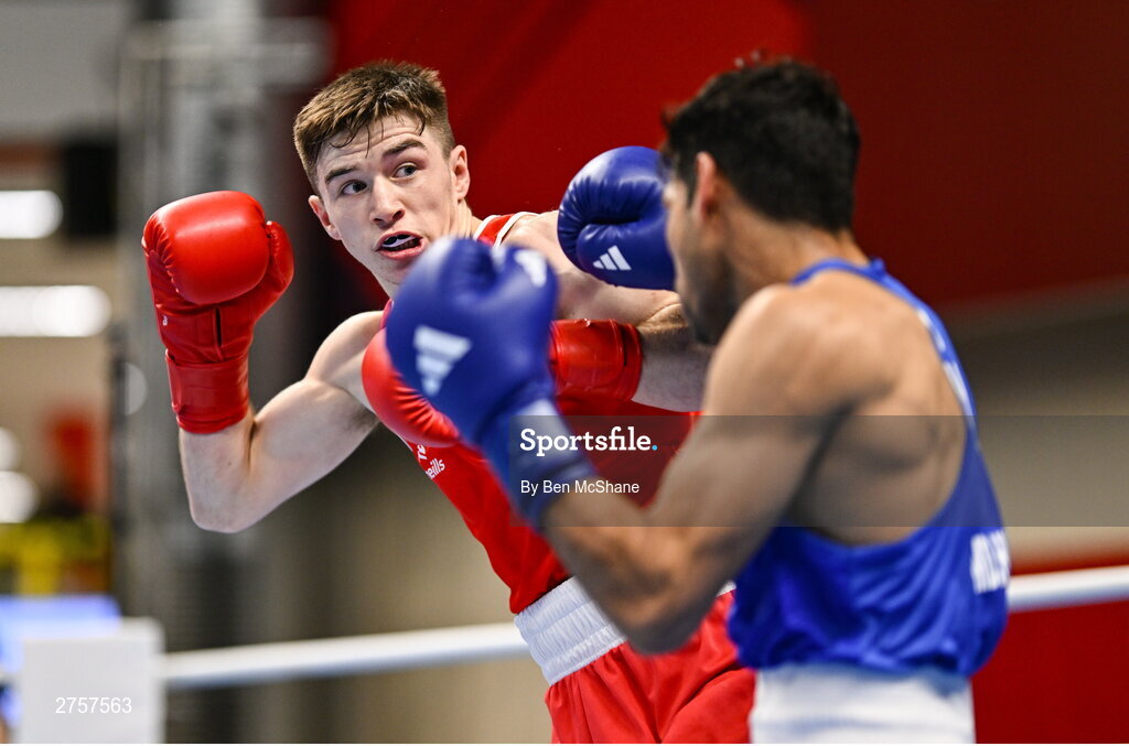 8 March 2024; Jude Gallagher of Ireland, left, in action against Uddin Mohammed Hussam of India during their Men's 57kg Round of 32 bout during day six at the Paris 2024 Olympic Boxing Qualification Tournament at E-Work Arena in Busto Arsizio, Italy. Photo by Ben McShane/Sportsfile