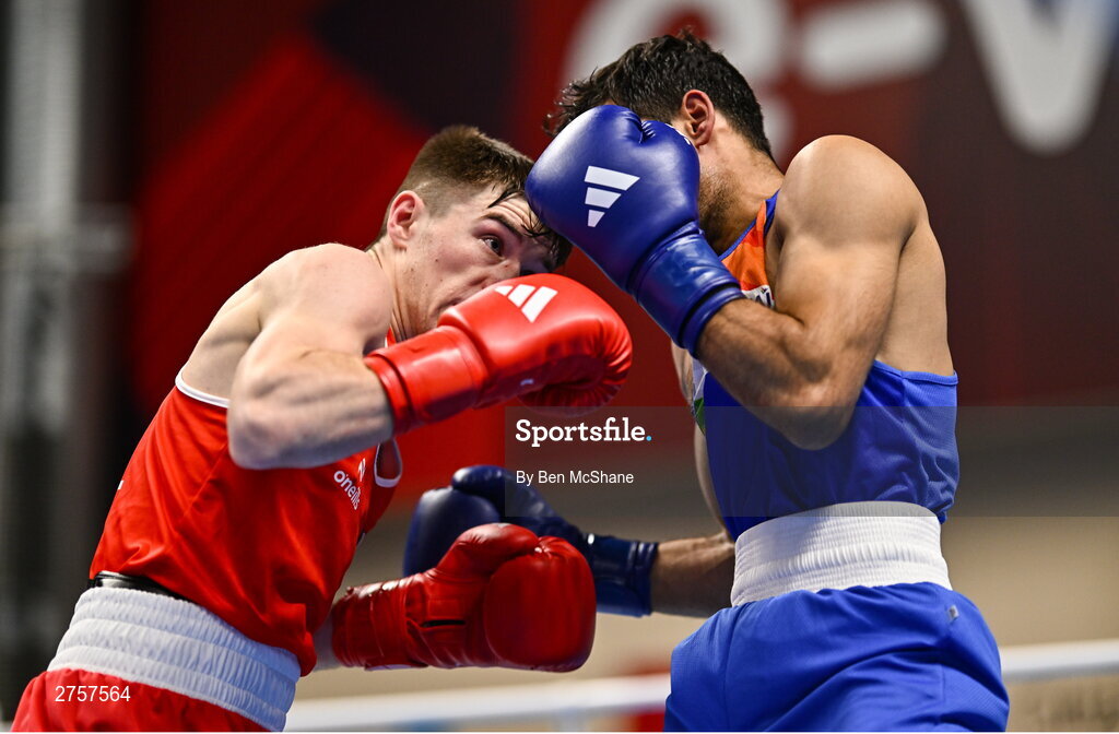 8 March 2024; Jude Gallagher of Ireland, left, in action against Uddin Mohammed Hussam of India during their Men's 57kg Round of 32 bout during day six at the Paris 2024 Olympic Boxing Qualification Tournament at E-Work Arena in Busto Arsizio, Italy. Photo by Ben McShane/Sportsfile