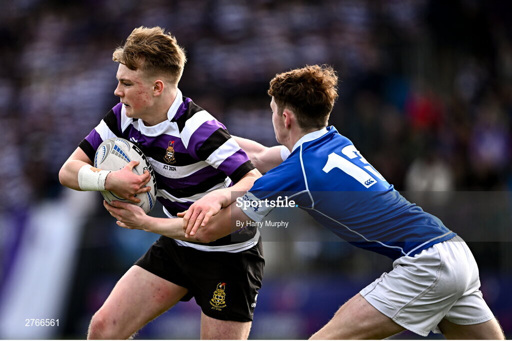 20 March 2024; Ewan McGinty of Terenure College is tackled by Donal Manzor of St Mary’s College during the Bank of Ireland Leinster Schools Junior Cup final match between St Mary's College and Terenure College at Energia Park in Dublin. Photo by Harry Murphy/Sportsfile