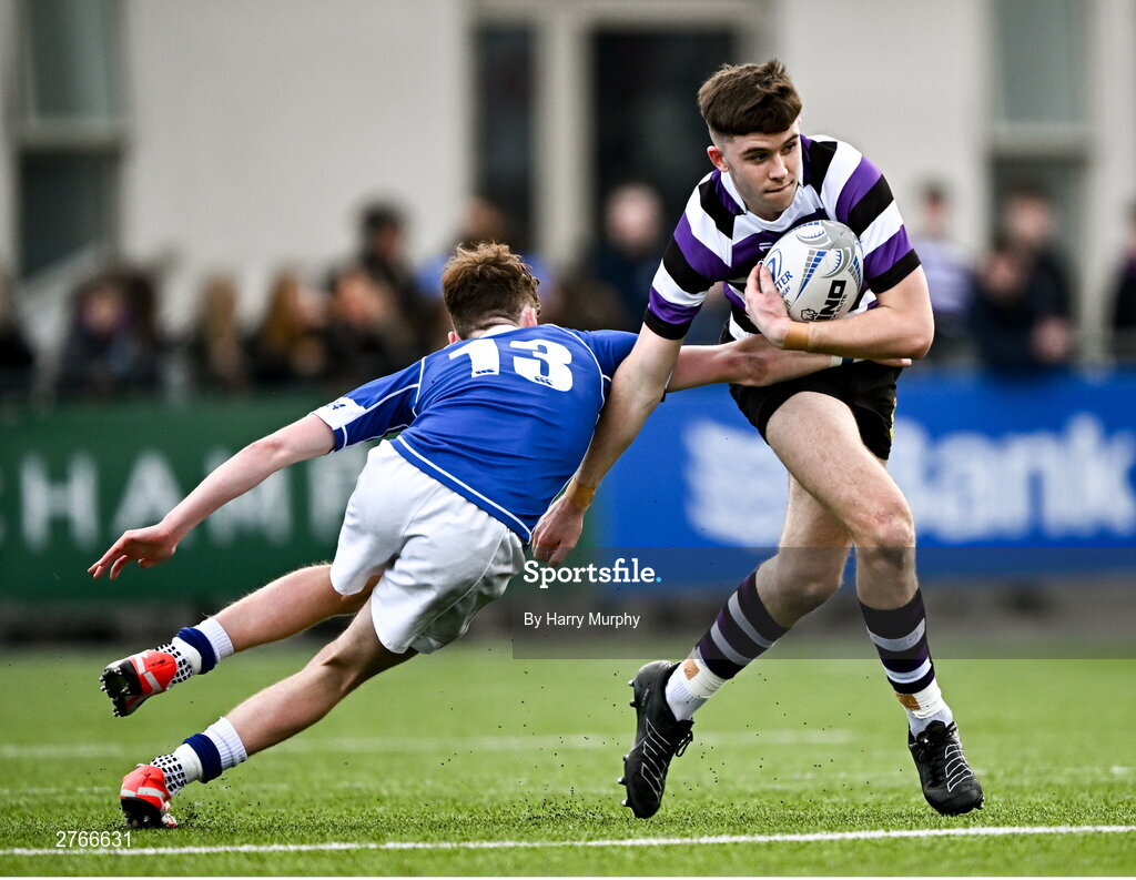 20 March 2024; Niall Fallon of Terenure College is tackled by Donal Manzor of St Mary’s College during the Bank of Ireland Leinster Schools Junior Cup final match between St Mary's College and Terenure College at Energia Park in Dublin. Photo by Harry Murphy/Sportsfile