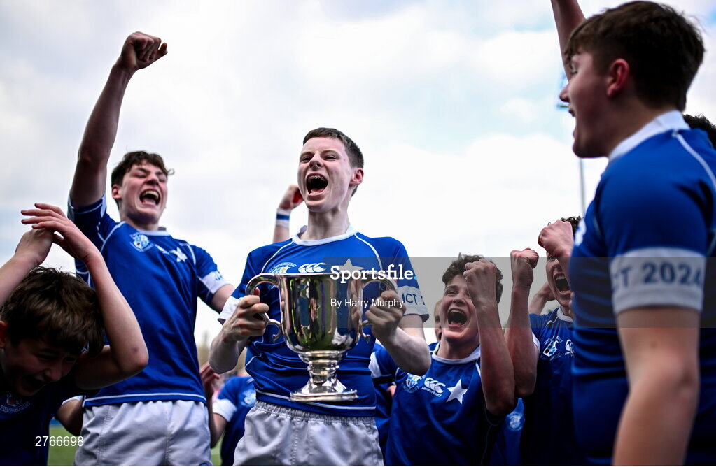 20 March 2024; Tom O’Keefe of St Mary’s College celebrates with the trophy after his side's victory in the Bank of Ireland Leinster Schools Junior Cup final match between St Mary's College and Terenure College at Energia Park in Dublin. Photo by Harry Murphy/Sportsfile