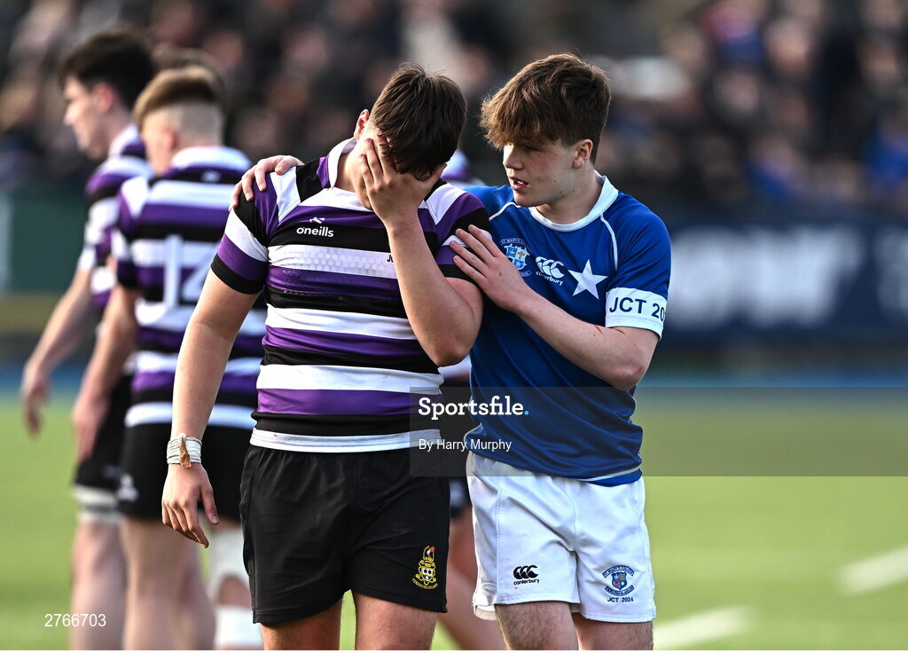 20 March 2024; Daniel McKenna of Terenure College is consoled by Nic Sheehan of St Mary’s College after the Bank of Ireland Leinster Schools Junior Cup final match between St Mary's College and Terenure College at Energia Park in Dublin. Photo by Harry Murphy/Sportsfile