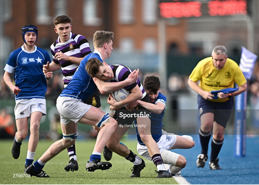 20 March 2024; Andrew Smyth of Terenure College is tackled by Eoin Farrell and Jack Fogarty of St Mary’s College during the Bank of Ireland Leinster Schools Junior Cup final match between St Mary's College and Terenure College at Energia Park in Dublin. Photo by Harry Murphy/Sportsfile