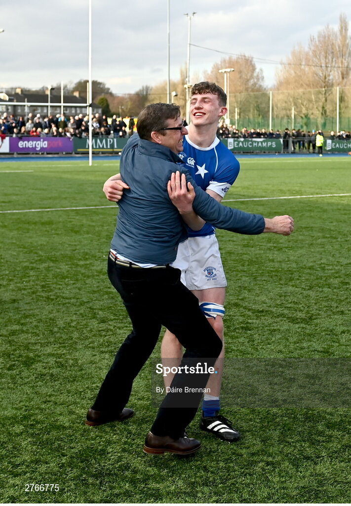 20 March 2024; Eoin Farrell of St Mary’s College celebrates with his dad Peter after the Bank of Ireland Leinster Schools Junior Cup final match between St Mary's College and Terenure College at Energia Park in Dublin. Photo by Daire Brennan/Sportsfile