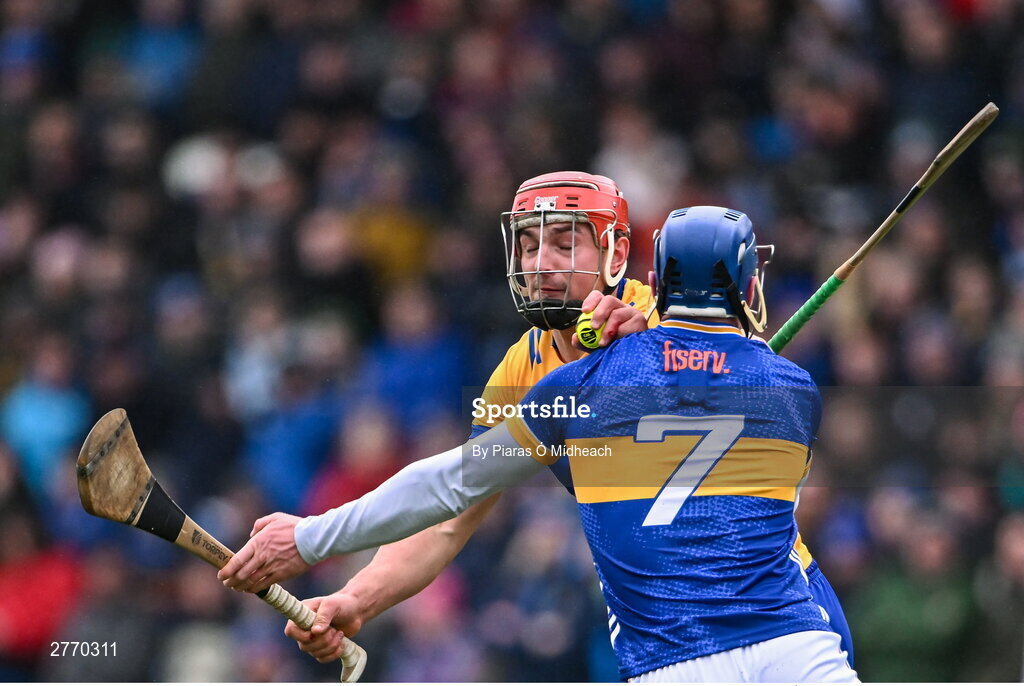 24 March 2024; Peter Duggan of Clare in action against Conor Bowe of Tipperary during the Allianz Hurling League Division 1 semi-final match between Clare and Tipperary at Laois Hire O'Moore Park in Portlaoise, Laois. Photo by Piaras Ó Mídheach/Sportsfile