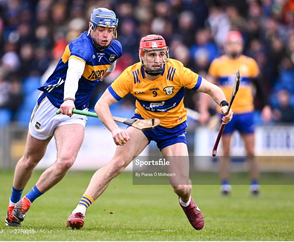 24 March 2024; Darragh Lohan of Clare in action against Conor Bowe of Tipperary during the Allianz Hurling League Division 1 semi-final match between Clare and Tipperary at Laois Hire O'Moore Park in Portlaoise, Laois. Photo by Piaras Ó Mídheach/Sportsfile
