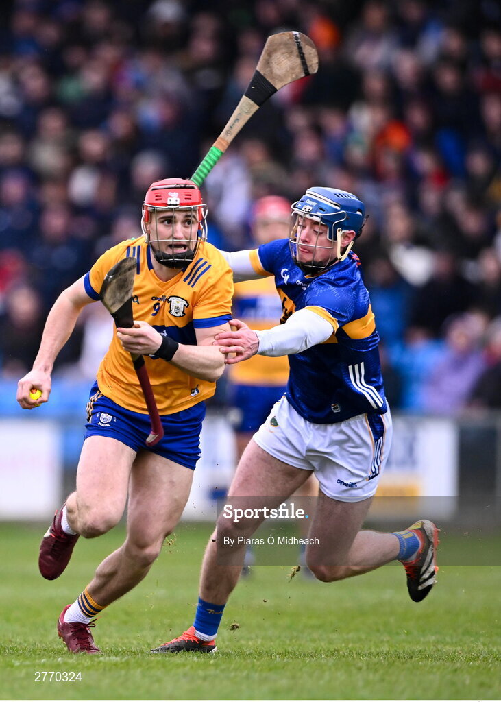 24 March 2024; Darragh Lohan of Clare in action against Conor Bowe of Tipperary during the Allianz Hurling League Division 1 semi-final match between Clare and Tipperary at Laois Hire O'Moore Park in Portlaoise, Laois. Photo by Piaras Ó Mídheach/Sportsfile