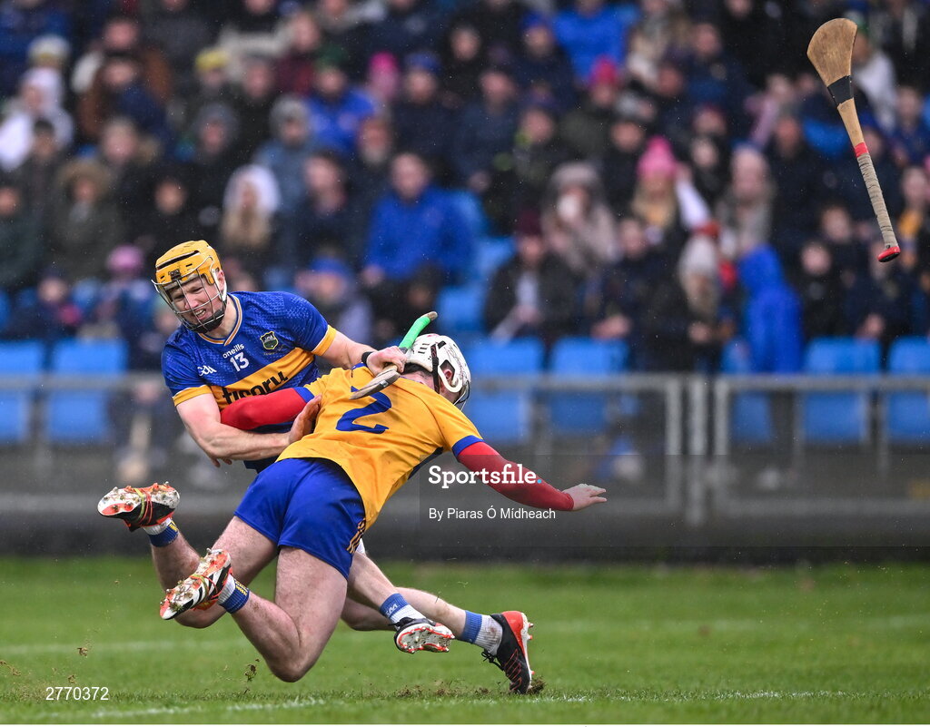 24 March 2024; Jake Morris of Tipperary and Adam Hogan of Clare tussle during the Allianz Hurling League Division 1 semi-final match between Clare and Tipperary at Laois Hire O'Moore Park in Portlaoise, Laois. Photo by Piaras Ó Mídheach/Sportsfile