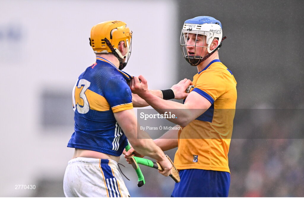 24 March 2024; Diarmuid Ryan of Clare and Patrick Maher of Tipperary tussle during the Allianz Hurling League Division 1 semi-final match between Clare and Tipperary at Laois Hire O'Moore Park in Portlaoise, Laois. Photo by Piaras Ó Mídheach/Sportsfile