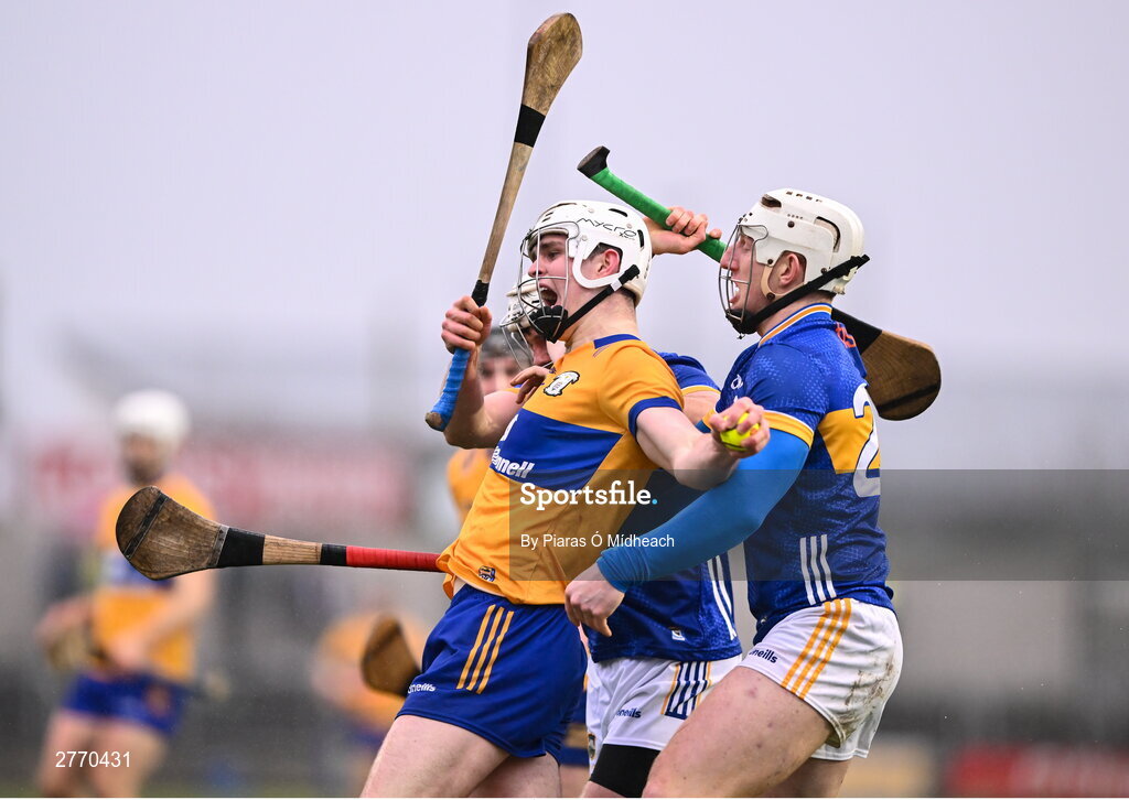 24 March 2024; Cian Galvin of Clare in action against Séan Ryan, right, and Johnny Ryan of Tipperary during the Allianz Hurling League Division 1 semi-final match between Clare and Tipperary at Laois Hire O'Moore Park in Portlaoise, Laois. Photo by Piaras Ó Mídheach/Sportsfile