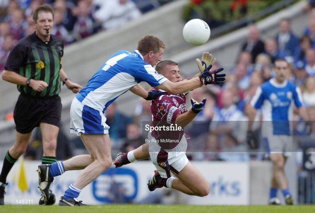 24 July 2004; Alan Mangan, Westmeath, is tackled by Laois' Paul McDonald. Bank of Ireland Leinster Senior Football Championship Final Replay, Westmeath v Laois, Croke Park, Dublin. Picture credit; Ray McManus / SPORTSFILE