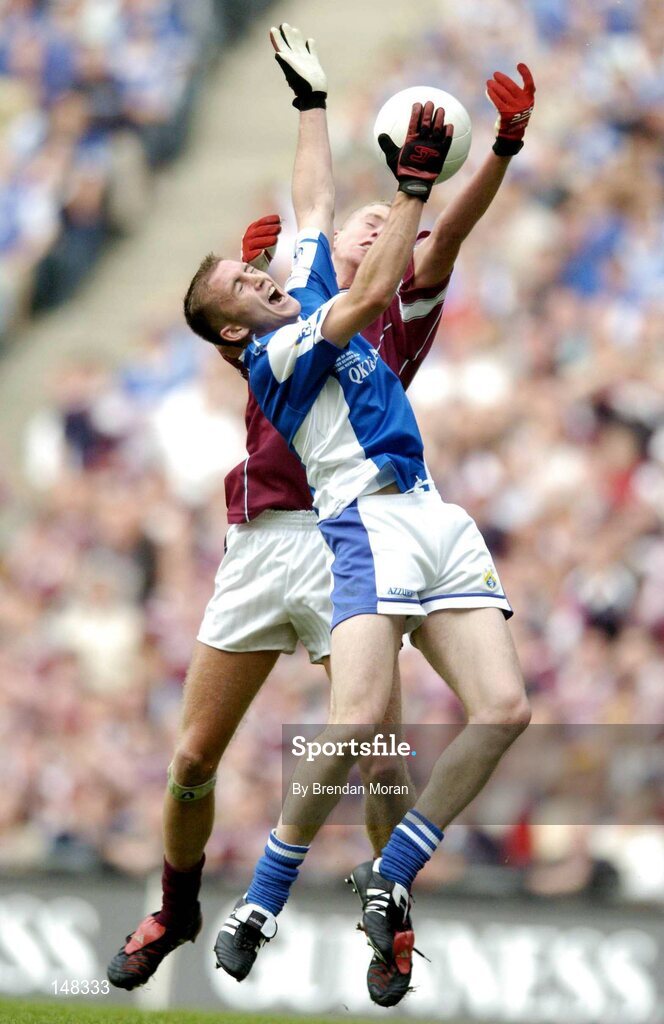 24 July 2004; Joe Higgins, Laois, in action against Denis Glennon, Westmeath. Bank of Ireland Leinster Senior Football Championship Final Replay, Westmeath v Laois, Croke Park, Dublin. Picture credit; Brendan Moran / SPORTSFILE