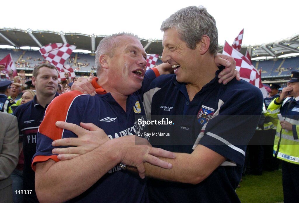 24 July 2004; Westmeath manager Paidi O Se, left, and selector Tomas O'Flaharta celebrate victory over Laois. Bank of Ireland Leinster Senior Football Championship Final Replay, Westmeath v Laois, Croke Park, Dublin. Picture credit; Ray McManus / SPORTSFILE