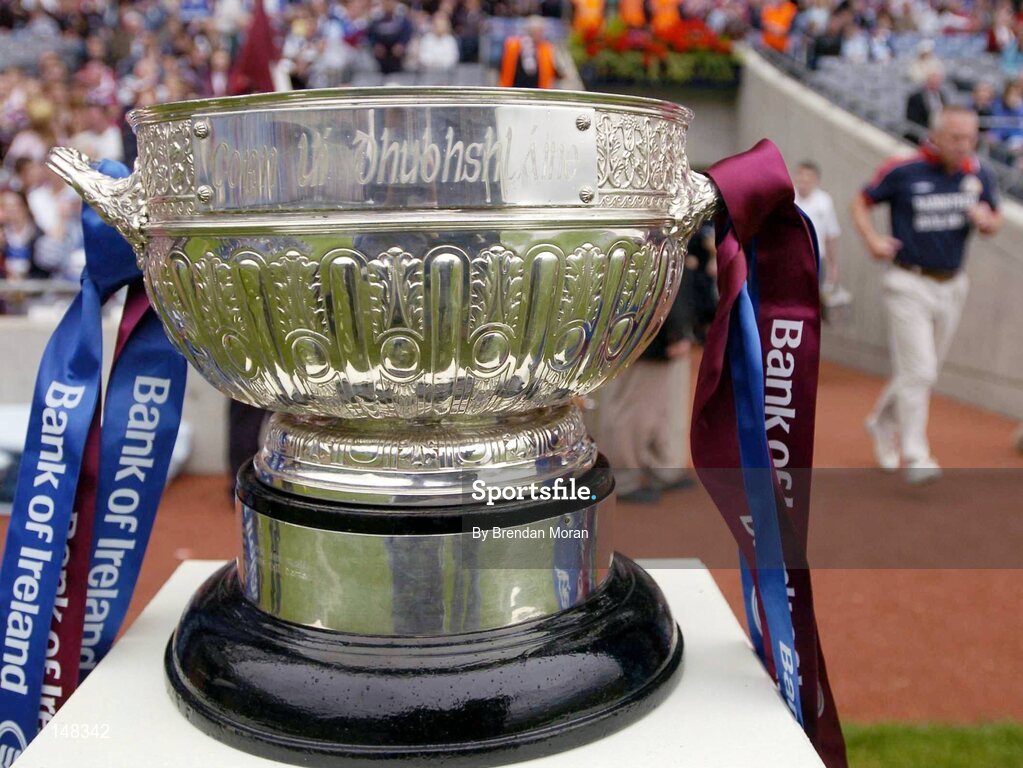 24 July 2004; Westmeath manager Paidi O Se runs past the Leinster trophy and out onto the pitch before the start of the game. Bank of Ireland Leinster Senior Football Championship Final Replay, Westmeath v Laois, Croke Park, Dublin. Picture credit; Brendan Moran / SPORTSFILE