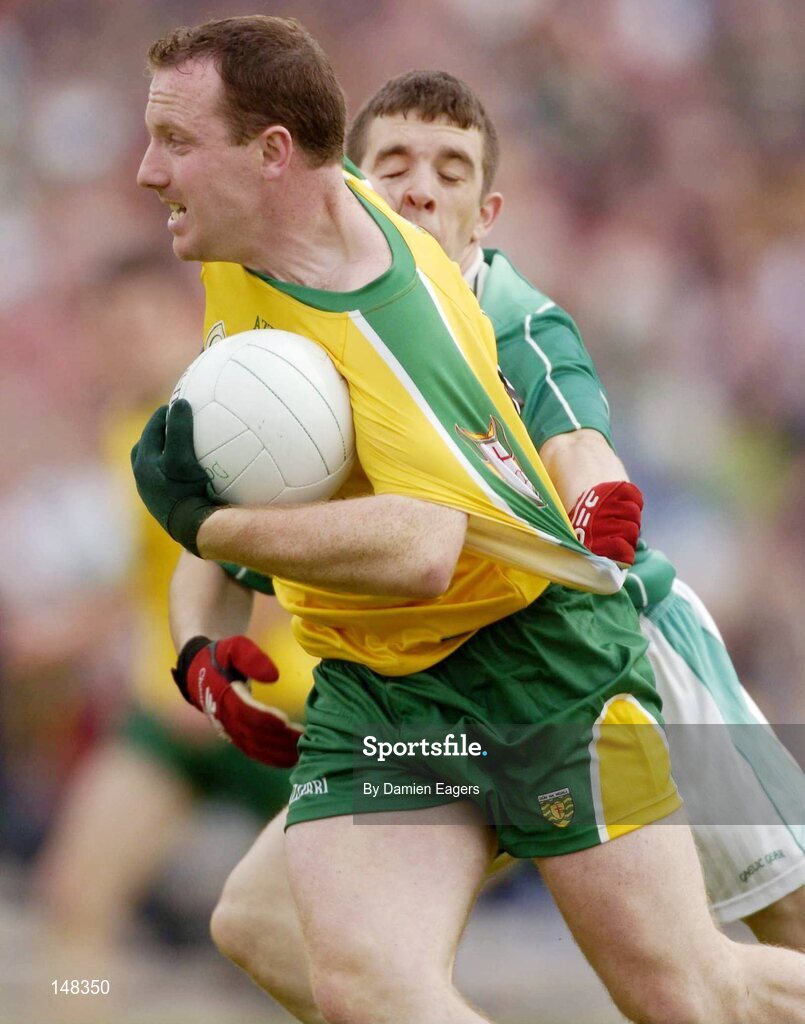 24 July 2004; Adrian Sweeney, Donegal, is tackled by Fermanagh's Barry Owens. Bank of Ireland Senior Football Championship Qualifier, Round 4, Fermanagh v Donegal, Tighernach's Park, Clones. Co. Monaghan. Picture credit; Damien Eagers / SPORTSFILE