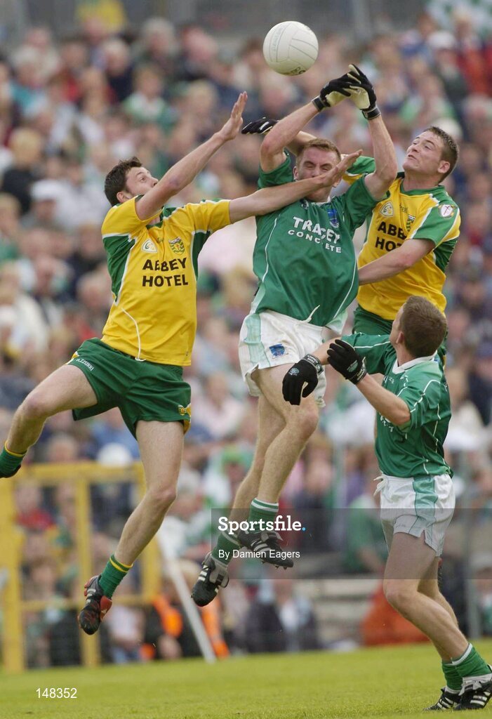 24 July 2004; Donegal's Christy Toye, left, and Brendan Boyle, in action against Fermanagh's Martin McGrath and Shane McDermott, right. Bank of Ireland Senior Football Championship Qualifier, Round 4, Fermanagh v Donegal, Tighernach's Park, Clones. Co. Monaghan. Picture credit; Damien Eagers / SPORTSFILE