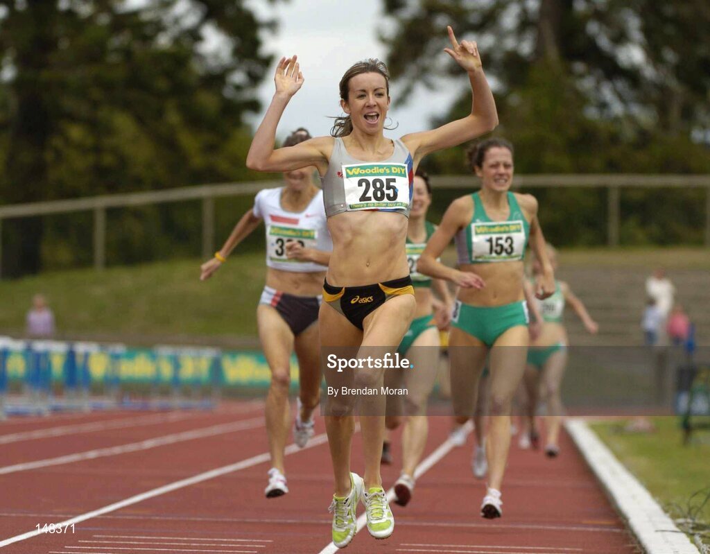 25 July 2004; Aoife Byrne, Dundrum South Dublin AC, celebrates her victory in the Women's 800m Final ahead of second placed Kelly McNiece Reid (153), Lisburn AC and third placed Sonia O'Sullivan (300), Ballymore Cobh AC. AAI Senior Track and Field Championships, Morton Stadium, Santry, Dublin. Picture credit; Brendan Moran / SPORTSFILE
