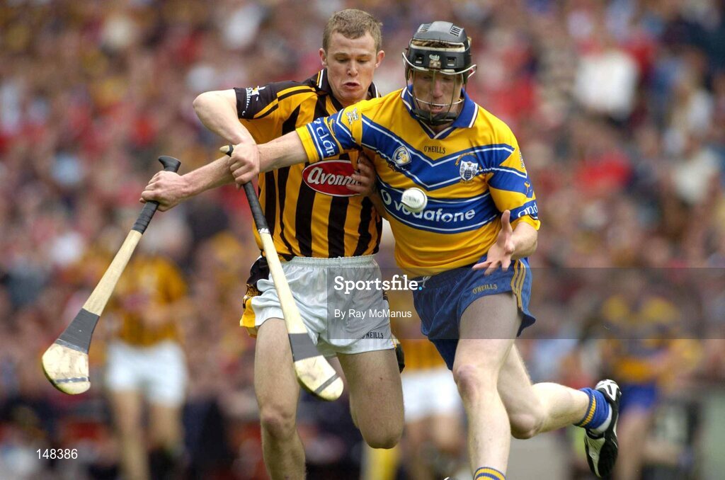 25 July 2004; Niall Gilligan, Clare, is tackled by Kilkenny's Tommy Walsh. Guinness All-Ireland Senior Hurling Championship, Quarter Final, Clare v Kilkenny, Croke Park, Dublin. Picture credit; Ray McManus / SPORTSFILE